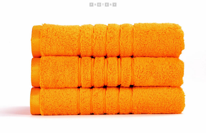 Promotivni luksuzni ručnik Brilliant 600g/m2, boje šafrana za strojni vez ili štik logotipa